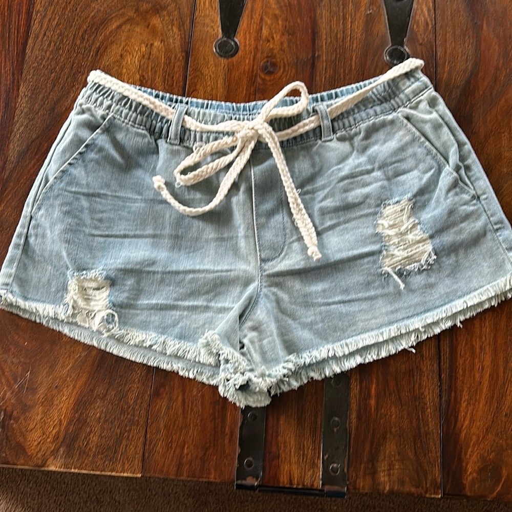 Aerie light washed jeans distressed shorts with braided removable belt.